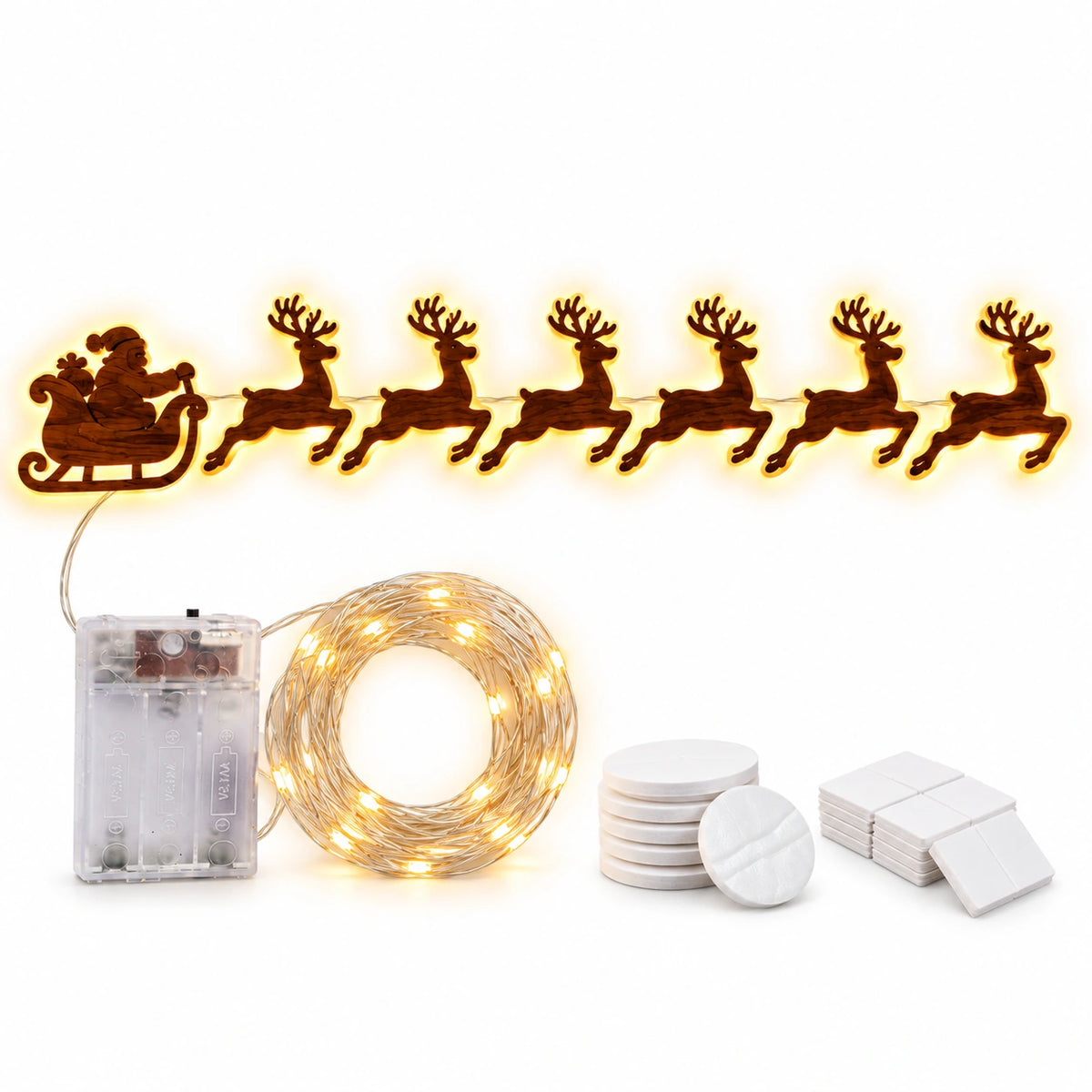 Warm white LED Christmas wall lights featuring Santa Claus in a sleigh pulled by six reindeer, with a battery box, string lights and adhesive mounting accessories.